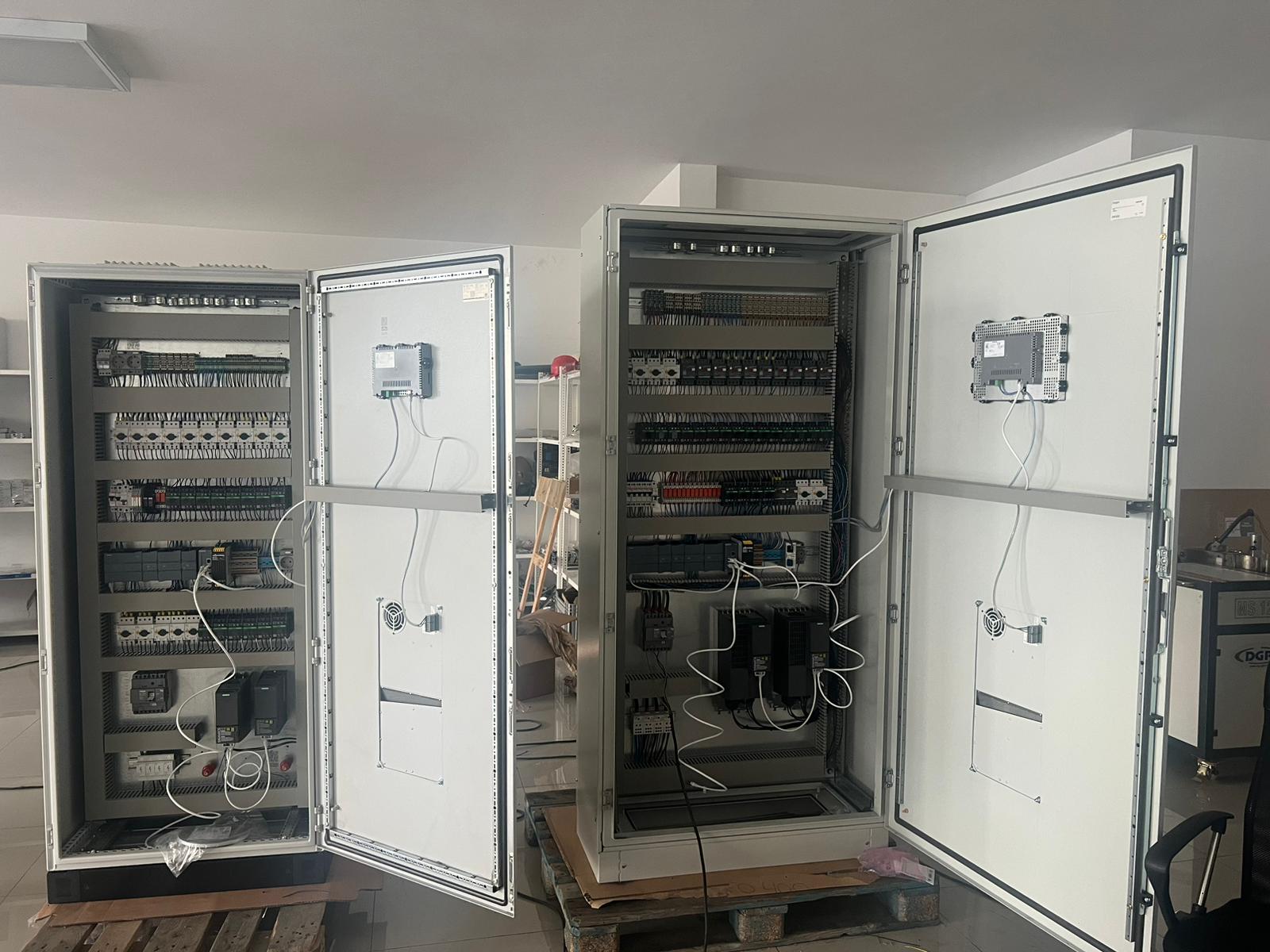 Twin control cabinets with HMIs mounted on doors